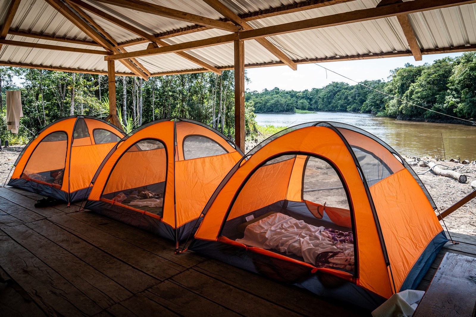 Glamping tents on the riverside platform