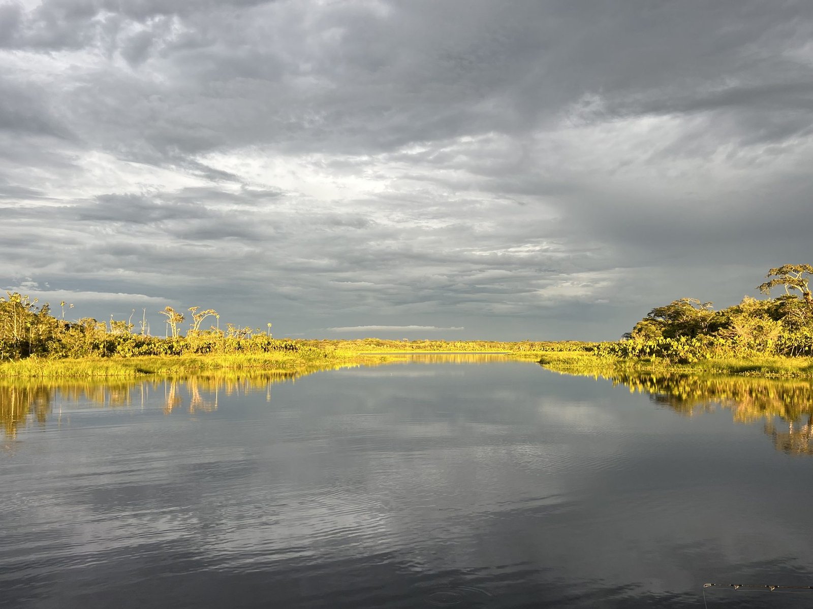 Golden hour over a mirror-still lagoon